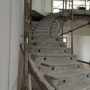 Metal components hidden in staircase