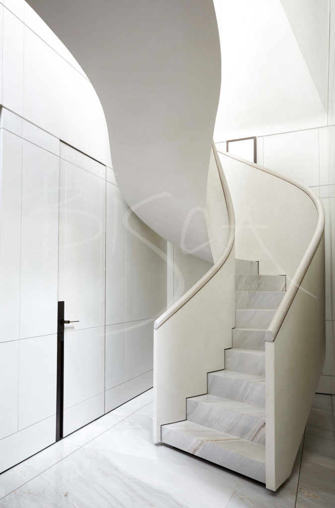 white helical curved spiral staircase