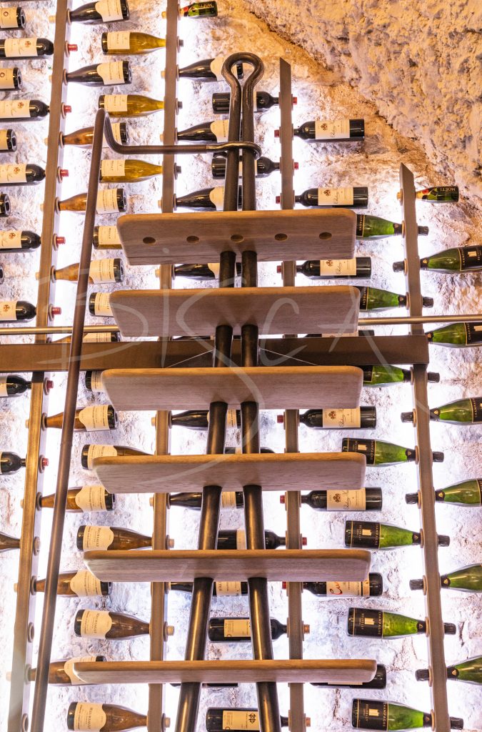 Illuminated-Bespoke-wine-wall-with-sliding-ladder-at-Belvelly-Castle