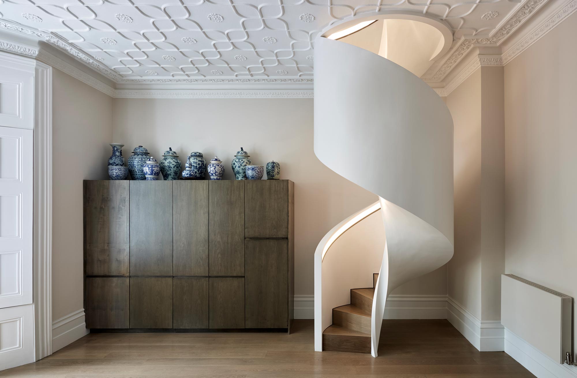 Staircase lighting concealed in the recessed handrail