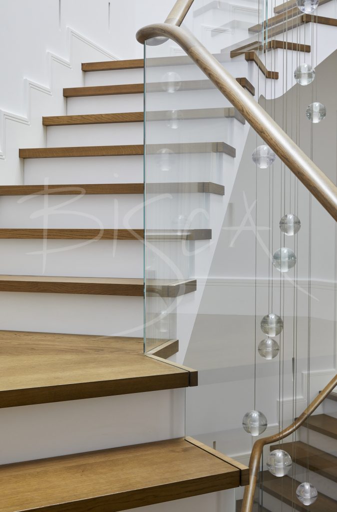 Elegant Glass Balustrade with Oak Handrail