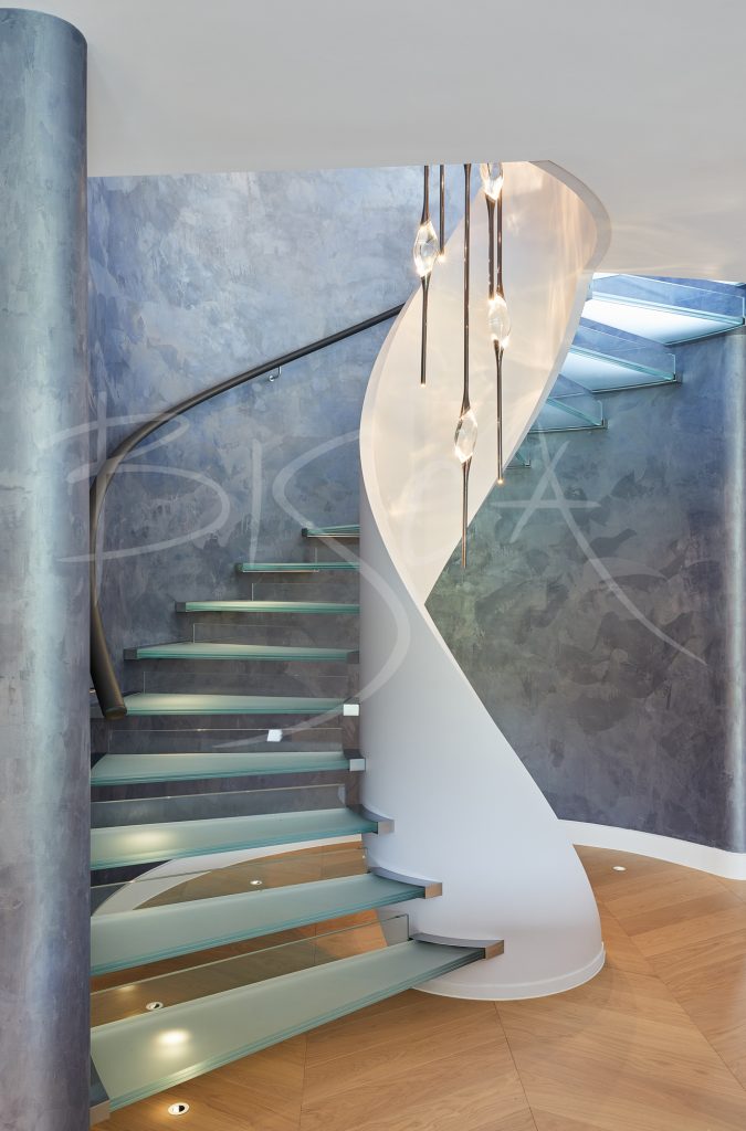 Modern Glass Staircase Coiled Around A Central Spine