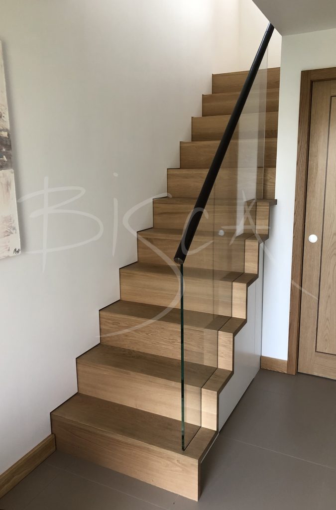 Modern kitchen staircase with storage