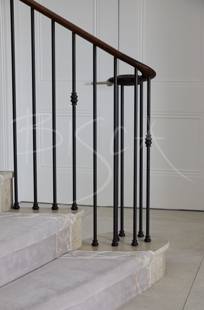 Sculptural Stone Staircase caged newel