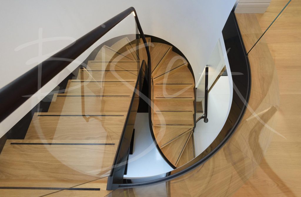 Elegant curved glass helical staircase
