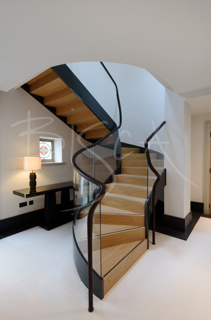 Elegant curved glass helical staircase