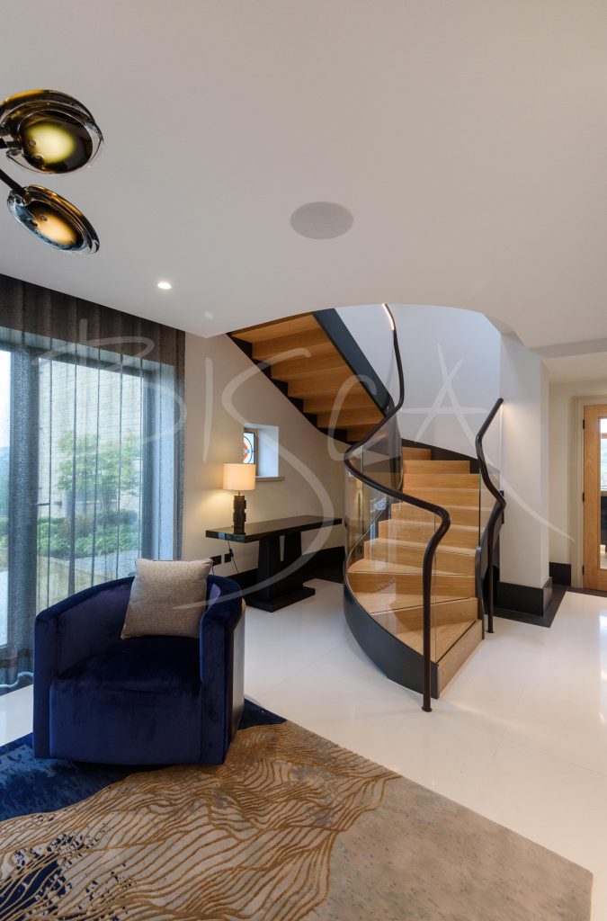 Elegant curved glass helical staircase
